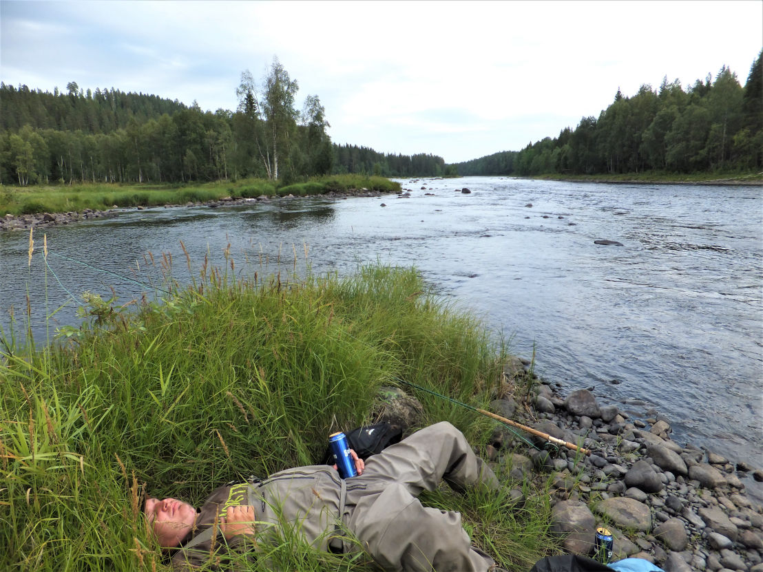 man resting at Byske river
