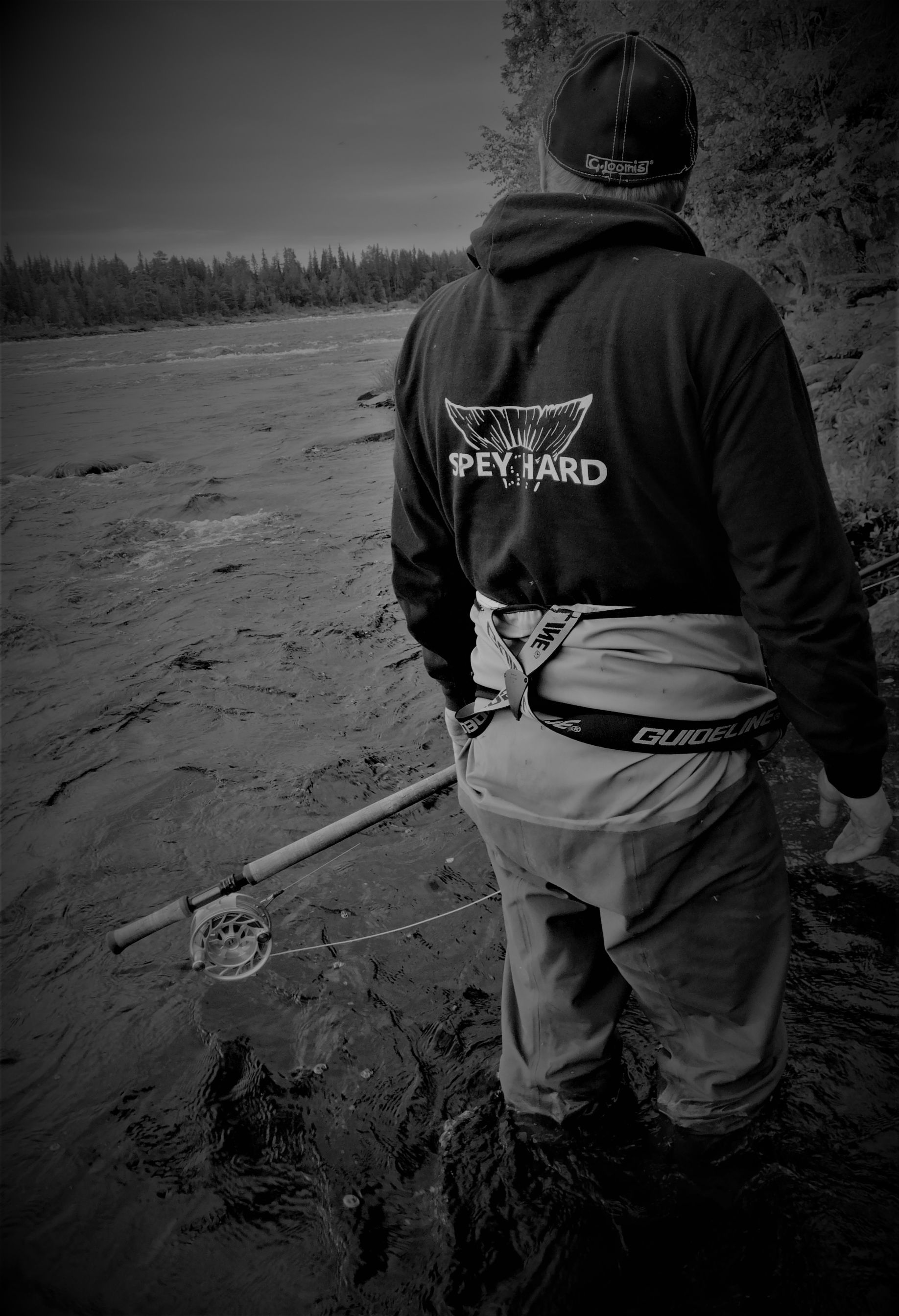 Spey casting on a Muonio river at cloudy day